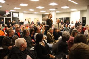 Residents attending a community board meeting