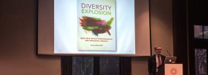 William Frey standing at the podium during the "Diversity Explosion" event