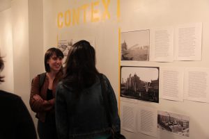 Visitors discuss the history portion of the exhibit through it's "Context" pieces