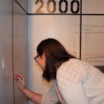 Gallery visitor adds to an interactive timeline