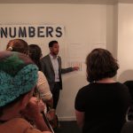 City Councilman Antonio Reynoso talks to students about "Numbers" portion of exhibit