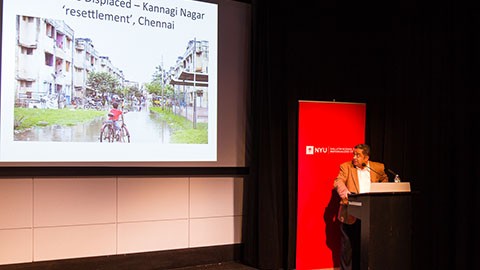 Balakrishnan Rajagopal presenting a slideshow during "The Right to the City as a Human Right" event