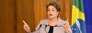 Former president of Brazil, Dilma Rousseff standing at a podium