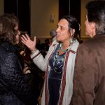 Winona LaDuke talking to others at the event