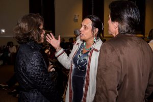 Winona LaDuke talking to others at the event